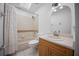 Well-lit bathroom featuring a shower-tub combination, vanity with sink, and a skylight at 2576 Ne 34Th St, Ocala, FL 34479