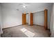 Bright bedroom featuring carpet floors, a ceiling fan and a large closet for ample storage space at 2576 Ne 34Th St, Ocala, FL 34479