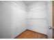 Walk-in closet with wood-look flooring and wire shelving at 2576 Ne 34Th St, Ocala, FL 34479