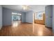 Open-concept living space with hardwood floors, vanity, and neutral blue walls with white trim at 2576 Ne 34Th St, Ocala, FL 34479