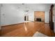 Bright living room features beautiful hardwood floors and a classic brick fireplace at 2576 Ne 34Th St, Ocala, FL 34479