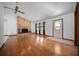 Inviting living room features hardwood floors and a brick fireplace creating a warm atmosphere at 2576 Ne 34Th St, Ocala, FL 34479