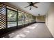 Enclosed back patio with screened windows and views of the lush landscaping at 2576 Ne 34Th St, Ocala, FL 34479