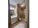 Well-lit bathroom featuring a shower-tub combo and tiled floors at 2701 Ne 10Th St # 403, Ocala, FL 34470
