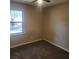 Neutral bedroom features carpet and a window offering natural light at 2701 Ne 10Th St # 403, Ocala, FL 34470