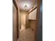 A view of the laundry room, featuring overhead cabinets and tile flooring at 2701 Ne 10Th St # 403, Ocala, FL 34470