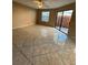 Spacious living room illuminated by natural light from large windows and a glass sliding door at 2701 Ne 10Th St # 403, Ocala, FL 34470