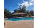 Community pool area with ample seating beneath a shaded gazebo at 2701 Ne 10Th St # 403, Ocala, FL 34470