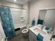 Cozy bathroom featuring shower-tub combo, light grey walls, and a light wood-look floor at 3338 Sw 165Th Loop, Ocala, FL 34473