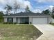 Charming single-story home features a well-manicured lawn and a two-car garage at 3338 Sw 165Th Loop, Ocala, FL 34473