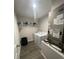 Functional laundry room equipped with washer, dryer, and ample shelving for storage, ensuring efficient laundry tasks at 3338 Sw 165Th Loop, Ocala, FL 34473