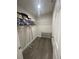 Spacious walk-in closet with shelves and racks, providing ample storage for clothes and accessories at 3338 Sw 165Th Loop, Ocala, FL 34473