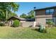 A spacious backyard with lush green grass surrounds this property and features privacy walls at 3815 Ne 17Th Street Cir, Ocala, FL 34470