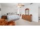 Bright bedroom with a ceiling fan and attached bathroom at 3815 Ne 17Th Street Cir, Ocala, FL 34470