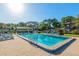 Sparkling community pool with chaise lounges for relaxing under the sun at 3815 Ne 17Th Street Cir, Ocala, FL 34470