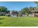 Community pool surrounded by lush landscaping and charming townhome exteriors at 3815 Ne 17Th Street Cir, Ocala, FL 34470