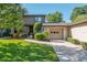 Charming townhome featuring well-maintained landscaping, an attached garage and a cozy front porch at 3815 Ne 17Th Street Cir, Ocala, FL 34470