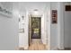 Bright foyer featuring wood floors and a view of the front door with a security screen at 3815 Ne 17Th Street Cir, Ocala, FL 34470