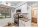 Modern kitchen with granite countertops, stainless steel appliances, and a stainless steel range at 3815 Ne 17Th Street Cir, Ocala, FL 34470
