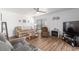 Relaxing living room with updated wood floors and plenty of natural light from the windows at 3815 Ne 17Th Street Cir, Ocala, FL 34470
