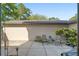 Private patio with outdoor seating, garden area, and neutral stucco wall at 3815 Ne 17Th Street Cir, Ocala, FL 34470
