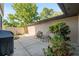 Enclosed patio with outdoor seating, garden, lighting and grill at 3815 Ne 17Th Street Cir, Ocala, FL 34470