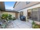 Charming patio featuring a grill, outdoor seating, and access to interior via sliding glass door at 3815 Ne 17Th Street Cir, Ocala, FL 34470