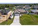 This home features a long driveway, large yard and a white fence at 4064 Sw 132Nd Ln, Ocala, FL 34473