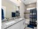Bathroom with double sink vanity with granite countertops and tiled shower/tub combo at 4064 Sw 132Nd Ln, Ocala, FL 34473