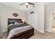 The carpeted bedroom includes a ceiling fan and a closet for storage at 4064 Sw 132Nd Ln, Ocala, FL 34473