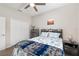 Bedroom with a bed, ceiling fan, carpeted floors, and views of the closet at 4064 Sw 132Nd Ln, Ocala, FL 34473