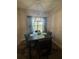 Cozy dining area features a modern chandelier, seating for four, and a bright window view at 4064 Sw 132Nd Ln, Ocala, FL 34473