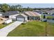 Charming single Gathering home features a large front yard and a two car garage at 4064 Sw 132Nd Ln, Ocala, FL 34473