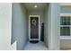 Welcoming front door with a decorative wreath and 'Welcome' sign at 4064 Sw 132Nd Ln, Ocala, FL 34473