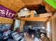 Organized garage features storage shelves, work space, and diamond plate accents at 4064 Sw 132Nd Ln, Ocala, FL 34473