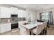 Well-equipped kitchen with stainless steel appliances, granite countertops, and island seating at 4064 Sw 132Nd Ln, Ocala, FL 34473
