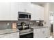 Detailed view of kitchen highlighting stainless steel appliances and stylish countertops at 4064 Sw 132Nd Ln, Ocala, FL 34473