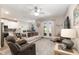 Spacious living area with neutral decor, ceiling fan, and patio access at 4064 Sw 132Nd Ln, Ocala, FL 34473