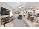 Spacious living room features a large TV, comfortable seating, and modern décor at 4064 Sw 132Nd Ln, Ocala, FL 34473