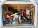 View of the shed's interior with cluttered storage at 4064 Sw 132Nd Ln, Ocala, FL 34473
