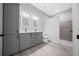 Modern bathroom with double vanity, white countertop, grey cabinets, and large walk-in shower at 4312 Sw 172Nd Place Rd, Ocala, FL 34473