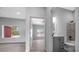 Bathroom with grey cabinets, quartz countertops, and tiled shower and bath at 4312 Sw 172Nd Place Rd, Ocala, FL 34473