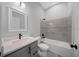 Bathroom featuring a single vanity, quartz countertop, framed mirror, and tiled shower and bath at 4312 Sw 172Nd Place Rd, Ocala, FL 34473