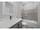 Bathroom featuring a single vanity, quartz countertop, framed mirror, and tiled shower and bath at 4312 Sw 172Nd Place Rd, Ocala, FL 34473