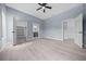 Spacious bedroom with fan, adjoining bathroom, walk-in closet with custom shelving, and abundant natural light at 4312 Sw 172Nd Place Rd, Ocala, FL 34473