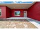 View of the front porch showing the window, exterior lighting, and front door at 4312 Sw 172Nd Place Rd, Ocala, FL 34473
