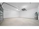 Spacious two-car garage with ample room for storage and parking with sealed concrete floors and a water heater at 4312 Sw 172Nd Place Rd, Ocala, FL 34473