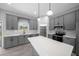 Elegant kitchen with stainless steel appliances, subway tile backsplash, and quartz countertops at 4312 Sw 172Nd Place Rd, Ocala, FL 34473
