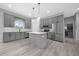 Modern kitchen featuring stainless steel appliances, an island, and gray cabinets at 4312 Sw 172Nd Place Rd, Ocala, FL 34473