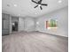 Spacious open-concept living room featuring hardwood floors and neutral paint, providing modern elegance at 4312 Sw 172Nd Place Rd, Ocala, FL 34473